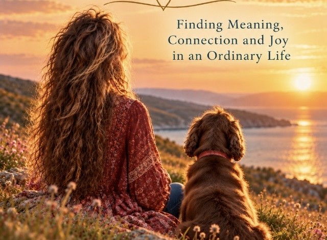 Woman and dog watching the sunset over the sea